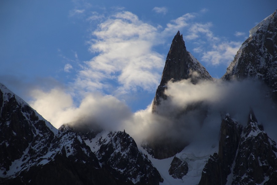 A jagged Karakoram spire emerging from clouds