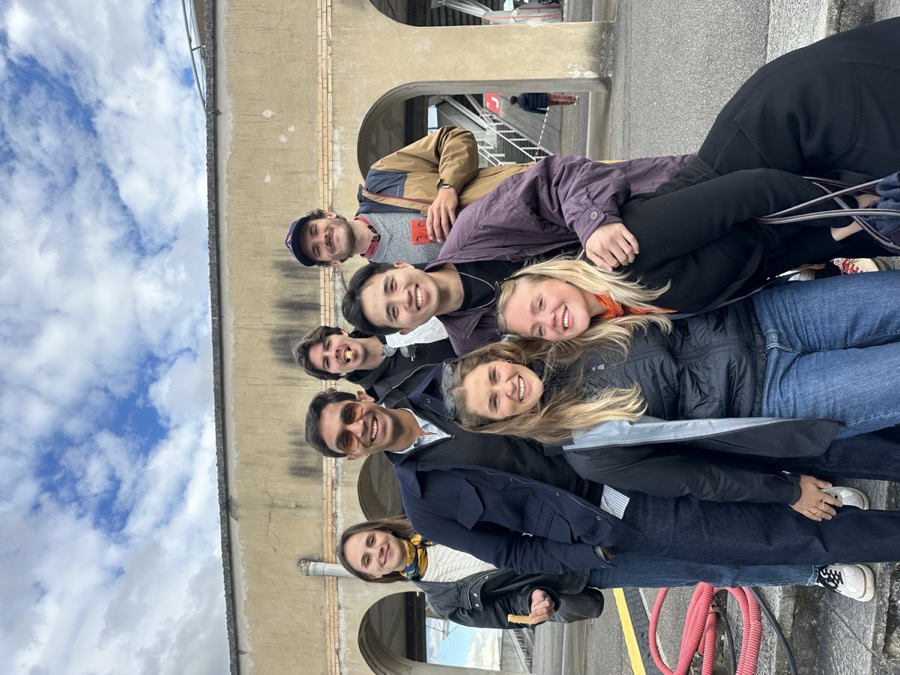 Talha with friends at an old stadium on a trip